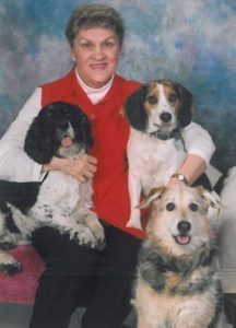 my mom with three of her dogs